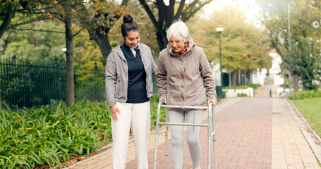 Senior woman, walker and nurse outdoor in a park with healthcare for elderly exercise. Walking,...
