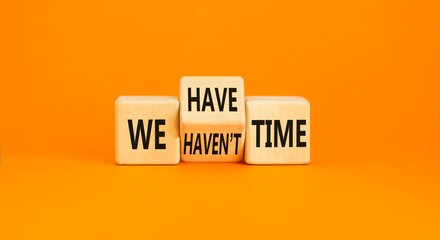 We have or not time symbol. Concept word We have or have not time on beautiful wooden cubes. Beautiful orange table orange background. Business and we have or not time concept. Copy space.