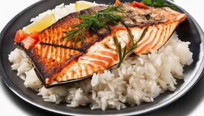 A plate of fish and rice with a lemon wedge on the side