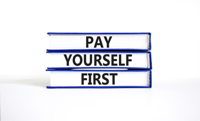 Pay yourself first symbol. Concept words Pay yourself first on beautiful books. Beautiful white table white background. Business and pay yourself first concept. Copy space.