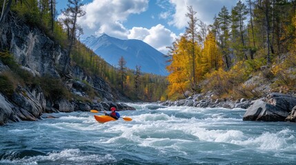 kayaker with whitewater kayaking, down a white water rapid river in the mountain