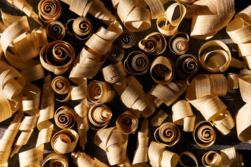 Close up background of many curled wood shavings