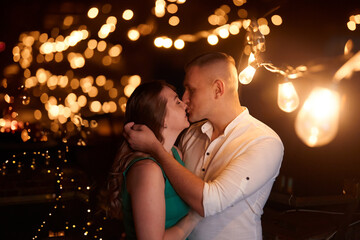 Portrait of young beautiful couple kissing