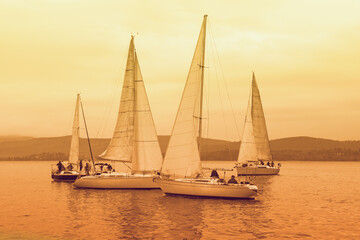 Sailing boats on water, regatta. Montenegro, Adriatic Sea,  Bay of Kotor. Toned image