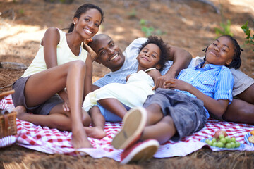 Portrait, relax and black family with forest picnic, hug or bonding in nature together. Love, food...