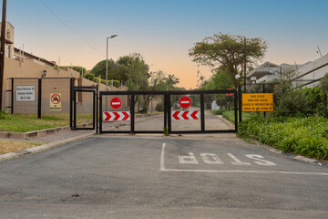 Residents in areas throughout Johannesburg, South Africa, have closed off public streets as a security measure amid fears of sky-high crime rates. - obrazy, fototapety, plakaty