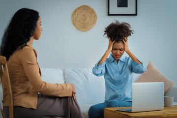 Sad PTSD woman patient in crucial therapy for mental health with psychologist, depression or grief...