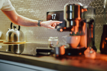 Smart home. Touch screen operation in a modern kitchen.