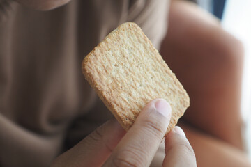 women holding a sweet cookies 