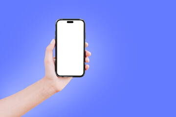 Close-up of male hand holding smartphone with blank on screen isolated on colourful background of blue colour. Mockup concept.