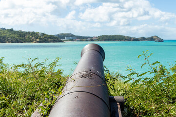 An ancient cannon pointed toward the harbor at Fort James on the island of Antigua in the Caribbean.