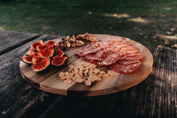 meat on a wooden board picnic
