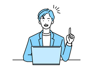 PCを操作しながら指差しポーズをする男性ビジネスパーソン(会社員)