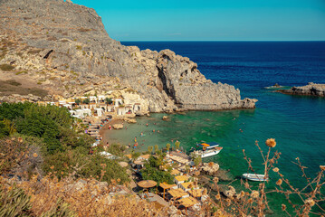 Secluded Mikros Gialos beach in Saint Paul's Bay in Rhodes.