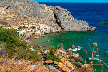 Secluded Mikros Gialos beach in Saint Paul's Bay in Rhodes.