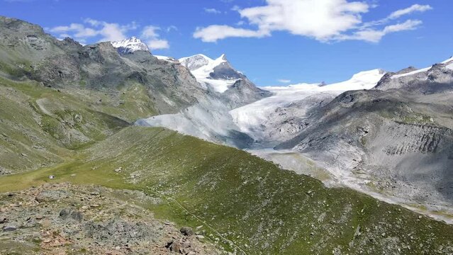 Spectacular Findel Glacier in the Monte Rosa massif east of Zermatt in the Pennine Alps in Switzerland featuring dramatic cloud shadows