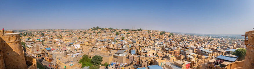 Fototapeta na wymiar Panoramic view of Jaisalmer city which is a popular destination among tourists for Thar desert and Golden fort historic palace architecture.