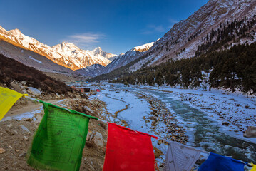 Serene Landscape of frozen Baspa river valley near Chitkul village in Kinnaur district of Himachal Pradesh, India. It is the last inhabited village near the Indo-China border.