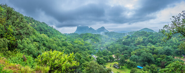 Panoramic view of Pachmarhi valley having clouds and mist shrouded hills rolling on each other from...