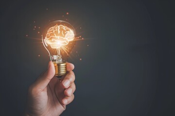Hand Holding Light Bulb With Brain Inside Symbolizes Smart Thinking And Innovation - obrazy, fototapety, plakaty
