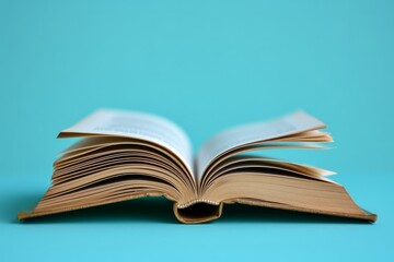 Open Book Rests On Solidcolored Surface, Leaving Space For Copy