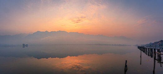 Panoramic landscape of Dal Lake nestled in Himalayas mountain range during sunrise on autumn...