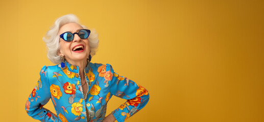 Very bright and happy old woman laughing in stylish glasses on a colored background. Close up shot of positive wrinkled old woman smiles toothily at camera wears glasses stylish outfit applies express - Powered by Adobe