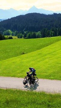 People on a Long Distance Bicycle Tour Riding Through the Allgäu Region in Bavaria