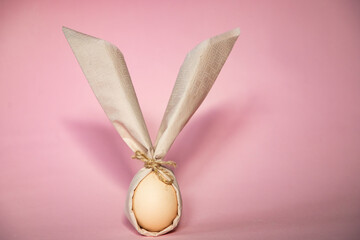 egg wrapped in easter bunny shaped napkin