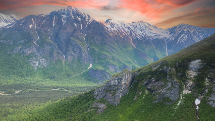 Lake Clark National Park and Preserve in Alaska. Aerial view of sunrise or sunset over rugged and remote mountains. 