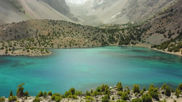 The Alaudin (Chapdara) lakes, lying at an altitude of 2800 m, are considered one of the most beautiful lakes of the Fan Mountains. Turquoise mountain lake. Pamiro-Alai. Tajikistan, Pamir 4K