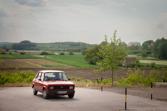Picture of a Skala car, red colors, branded as Zastava 55 and Yugo 55, parked in a car park of Ruma Serbia. Skala is a generic name for a family of cars built by Serbian manufacturer Zastava Automobil
