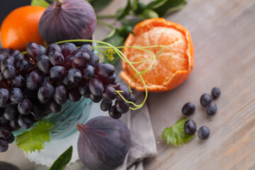 Naklejka na ściany i meble Grape against fruit background. Colorful organic food set