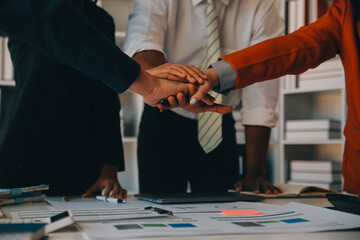 Large business team showing unity with their hands together