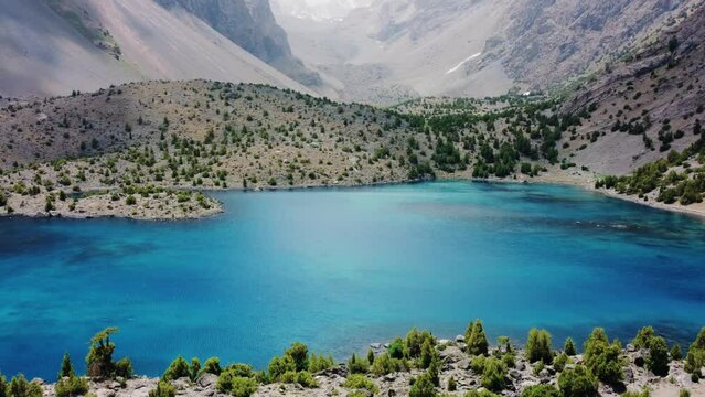 The Alaudin (Chapdara) lakes, lying at an altitude of 2800 m, are considered one of the most beautiful lakes of the Fan Mountains. Turquoise mountain lake. Pamiro-Alai. Tajikistan, Pamir 4K