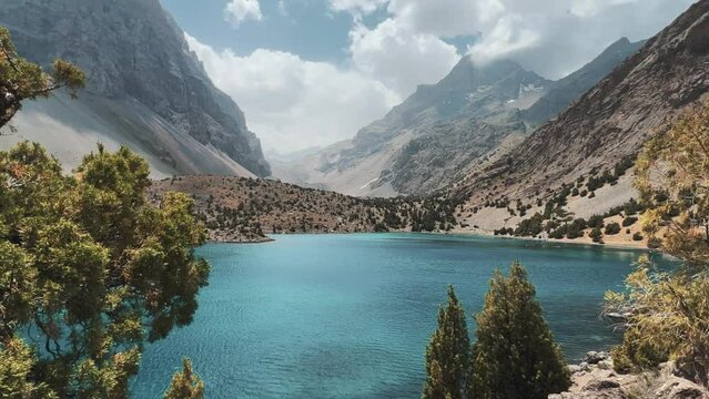 The Alaudin (Chapdara) lakes, lying at an altitude of 2800 m, are considered one of the most beautiful lakes of the Fan Mountains. Turquoise mountain lake. Pamiro-Alai. Tajikistan, Pamir 4K