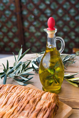 olive oil, extra virgin olive oil in a glass bottle, on a wooden table.
extra virgin olive oil, from organic olive groves in Greece, genuine taste of oil from the Mediterranean
