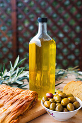olive oil, extra virgin olive oil in a glass bottle, on a wooden table.
extra virgin olive oil, from organic olive groves in Greece, genuine taste of oil from the Mediterranean
