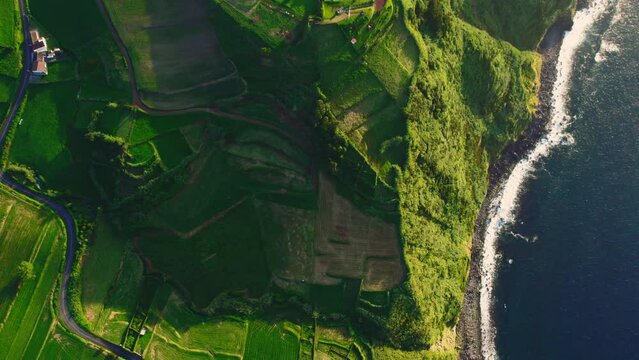 Aerial shot, drone point of view rocky coastline, Atlantic Ocean coastline of Island of Sao Miguel, Azores, Portugal. Travel destinations and beauty in nature concept