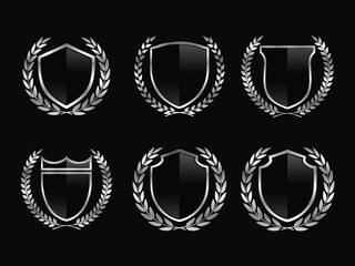 Set of black glass shield with metalic frame, metalic laurel wreath