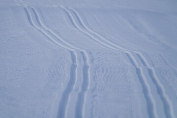 a freshly groomed cross country ski run on a agriculture field 