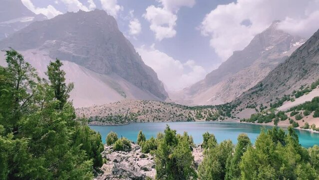 The Alaudin (Chapdara) lakes, lying at an altitude of 2800 m, are considered one of the most beautiful lakes of the Fan Mountains. Turquoise mountain lake. Pamiro-Alai. Tajikistan, Pamir 4K