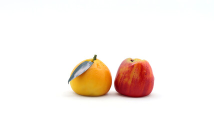 closeup of marzipan fruit on white background