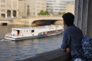 Young Observer Watching a Riverboat on the Spree, Berlin