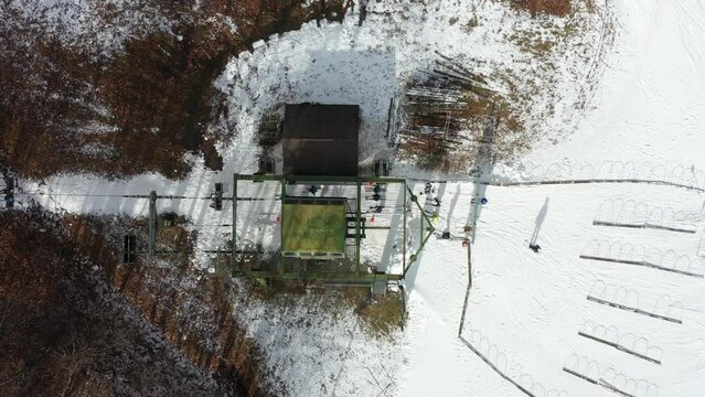 Aerial View of Skiers Getting on to a Ski Lift at a Mountain Resort