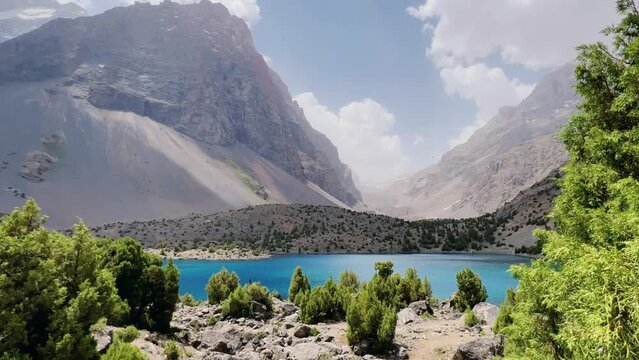 The Alaudin (Chapdara) lakes, lying at an altitude of 2800 m, are considered one of the most beautiful lakes of the Fan Mountains. Turquoise mountain lake. Pamiro-Alai. Tajikistan, Pamir 4K