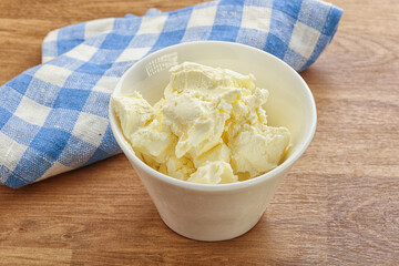 Italian soft mascarpone cheese in the bowl