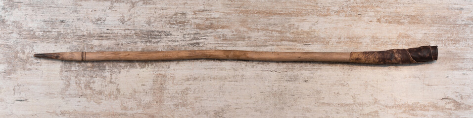 pointed stick isolated on wooden background