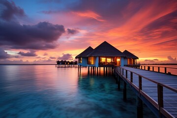 Obraz premium Pier With Hut at Sunset on a Calm Waterscape With Vibrant Colors, Water bungalow, Sunset on the islands of the Maldives, A place for dreams, AI Generated