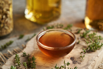 Homemade thyme syrup in a small bowl